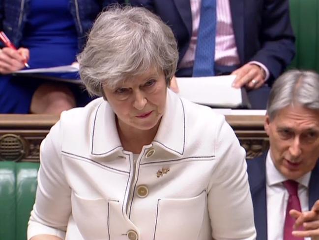 A video grab from footage broadcast by the UK Parliament's Parliamentary Recording Unit (PRU) shows Britain's Chancellor of the Exchequer Philip Hammond (R) gesturing as Britain's Prime Minister Theresa May makes a statement to the House of Commons in London on January 14, 2019. - Prime Minister Theresa May on Monday published further assurances from the EU on the eve of a crucial parliamentary vote on her Brexit deal and warned MPs that rejecting it would lead to "paralysis" that could see Britain stay in the bloc. (Photo by HO / PRU / AFP) / RESTRICTED TO EDITORIAL USE - MANDATORY CREDIT " AFP PHOTO / PRU " - NO USE FOR ENTERTAINMENT, SATIRICAL, MARKETING OR ADVERTISING CAMPAIGNS