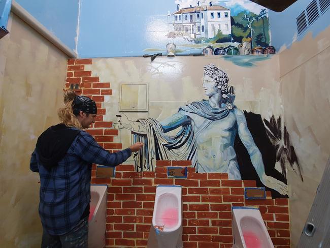 Akos Juhasz with the urinals painting.