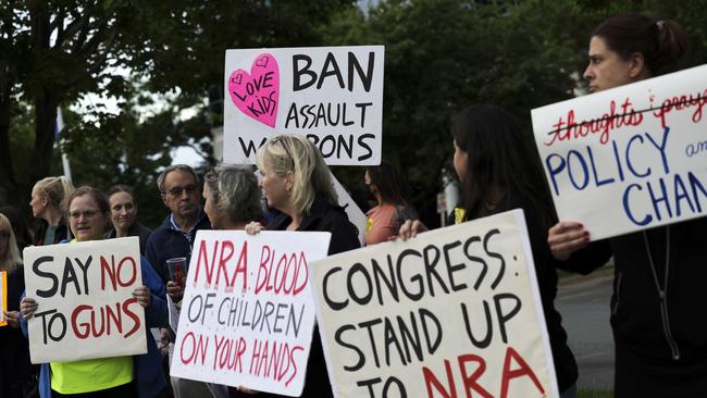 Gun-control advocates hold a vigil outside of the National Rifle Association (NRA) headquarters. Picture: Kevin Dietsch/Getty Images/AFP