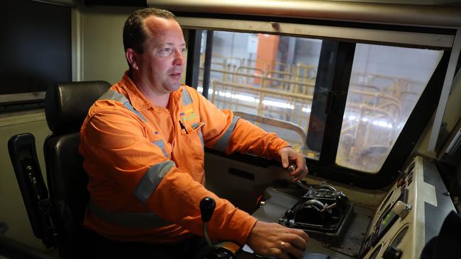 Driver trainer Rod Binding at the controls of one of Pacific National train engines. Pictured at the Greta service depot. It is one of the engines used to move coal to the Newcastle Port. Picture: Rohan Kelly