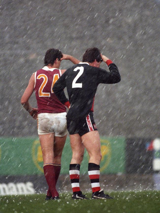 Roger Merrett and Frawley pelted with hail during a Brisbane Lions-St Kilda clash at Waverley Park in 1993.