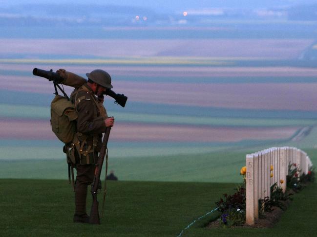 An Australian soldier pays his respects during Anzac Day, 2009. Picture: Michel Spingler/AP