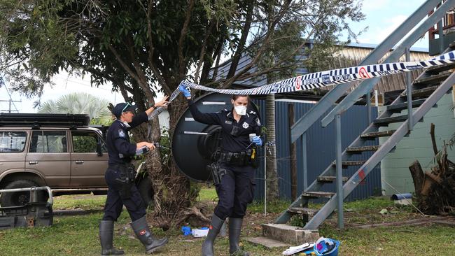 Officers investigate probe the cause of a fire that destroyed a brick house in Bungalow on Tuesday morning. Picture: Peter Carruthers