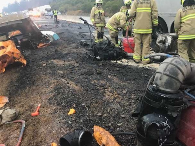 Emergency crews working at the scene of the truck crash at Glenugie. Picture: Frank Redwood