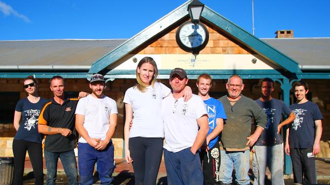 Staff and volunteers after cleaning up the George IV Inn in the days following the storm. Picture: Phillip Rogers