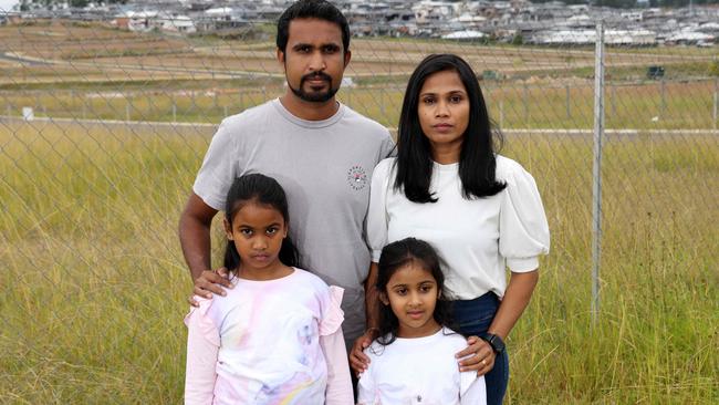 Anjana Premaratne, wife Manori Batagalla and their kids Liyana Premaratne, 5, and Methmi Premaratne, 7, at a proposed school site. Picture: Damian Shaw