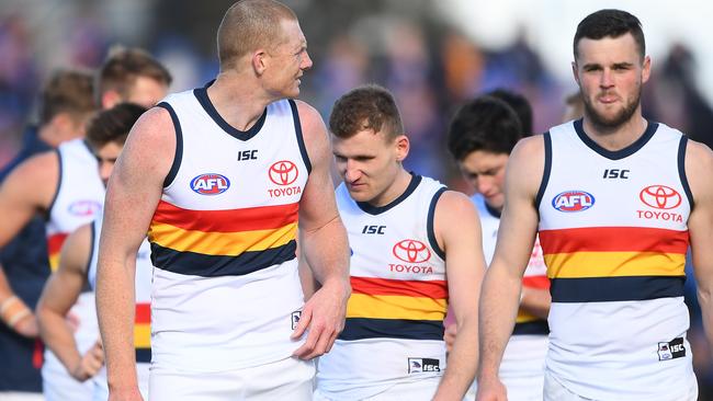 Sam Jacobs (left) trudges from Ballarat Oval after the Crows’ round 23 loss to the Western Bulldogs in his final game for the club. Picture: QUINN ROONEY (Getty Images).