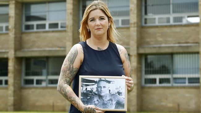 Matraville Sports High schoolteacher aide and Mental Wellness Gala day organiser Ashley Taylor with a photo of her late husband Ricky Taylor. Picture: John Appleyard