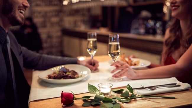 Reconnecting over dinner as a couple is an important part of our time away. Picture: iStock