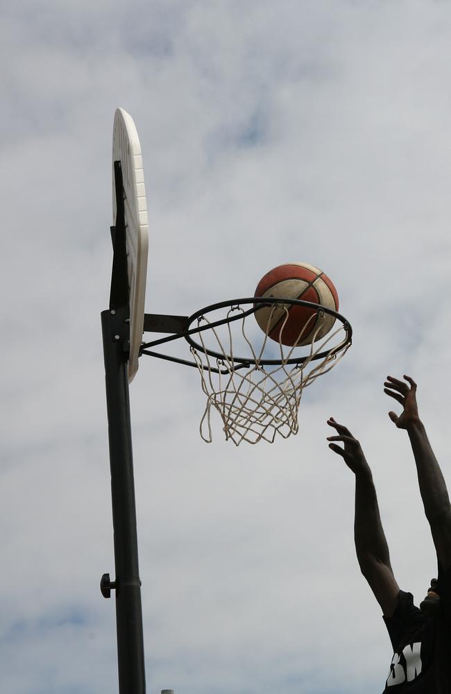 Shooting a hoop on a basketball court