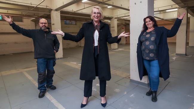 An old building in the Melbourne CBD will provide up to 50 studio apartments for the homeless. Pictured are Lord Mayor Sally Capp (centre) with Luis Herrera and Lisa Townsend, who used to be homeless. Picture: Ian Currie