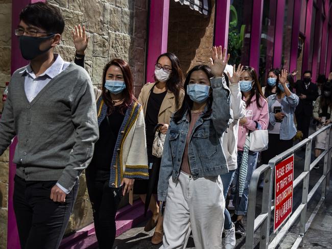 Office workers and pro-democracy protesters march during a demonstration in Hong Kong on November 29, 2019. Picture: Isaac Lawrence