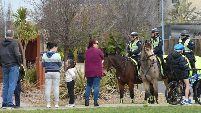 Patrolling officers speak with Taylors Hill residents. Picture: Nicole Garmston