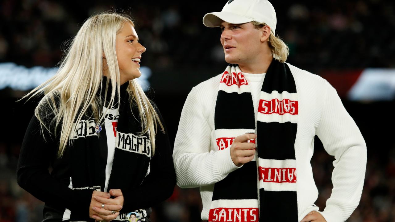 Brooke and Jackson Warne tossing the coin in their father’s honour at the St Kilda-Collingwood clash. Picture: Getty Images