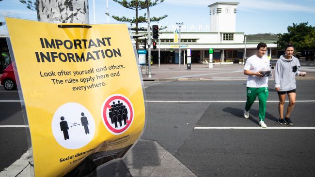 COVID-19 signs at Manly Wharf. Picture: Julian Andrews.