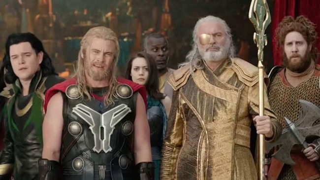 Matt Damon and Luke Hemsworth depicting Loki and Thor with Sam Neill in Thor: Ragnarok.