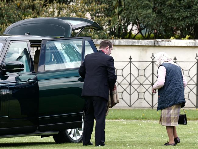 The Queen arrives at Kensington Palace by helicopter to meet Prince Louis for the first time.