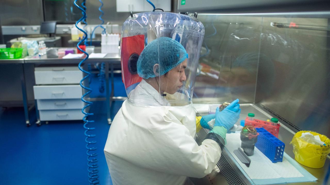 This file photo taken on February 23, 2017 shows a worker inside the P4 laboratory in Wuhan, the capital of China's Hubei province. Picture: Johannes Eisele / AFP