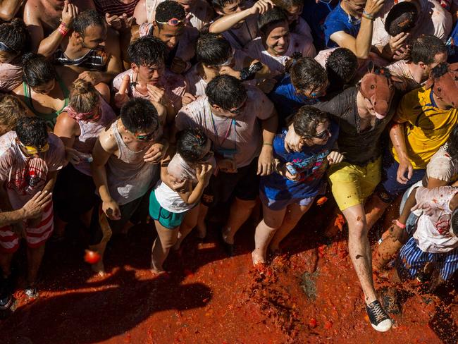 They hurled squashed tomatoes at each other.