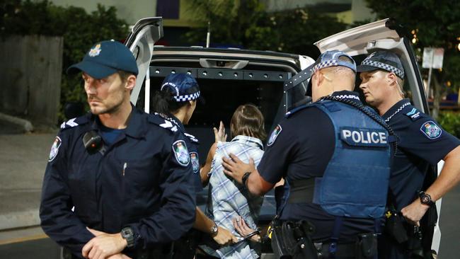 Tactical crime squad officers bundle an offender in a police vehicle in the Cairns CBD. PICTURE: JUSTIN BRIERTY