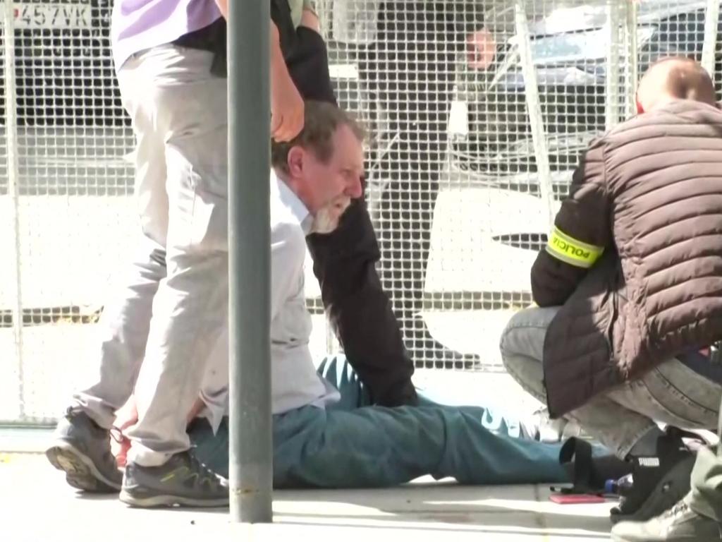 Security personnel apprehending a suspected gunman after Slovakia's Prime Minister was shot in Handlova. Picture: AFP