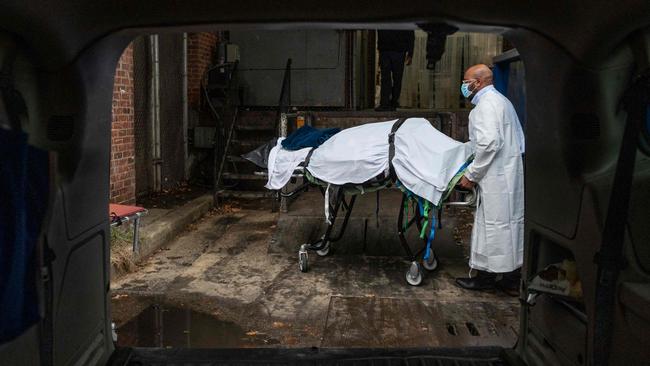 The remains of a Covid-19 victim are wheeled out of the hospital in Baltimore, Maryland. Picture: AFP