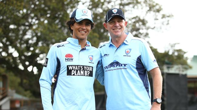 Oliver Davies being presented his Blues cap by Shawn Bradstreet during the Marsh One Day Cup match against Victoria at North Sydney Oval in February.