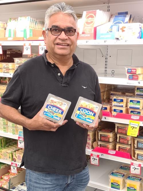 Dr Stephen Hagan with the rebranded Cheer cheese, which is on sale alongside the old brand Coon. Source: Supplied