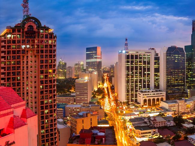 Night view of Makati business district in Manila, Philippines.