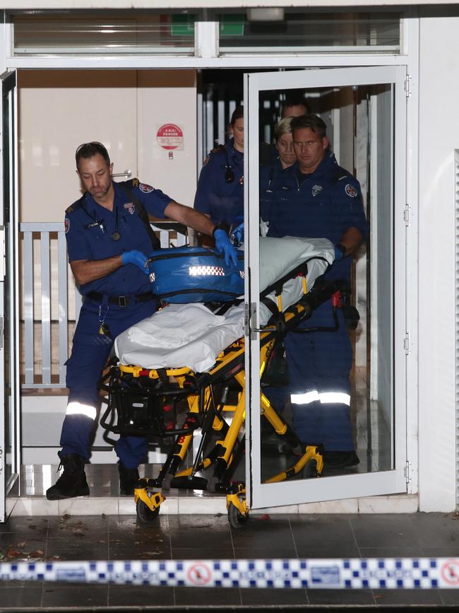 Barakat’s body being removed from his building. Picture: Bill Hearne