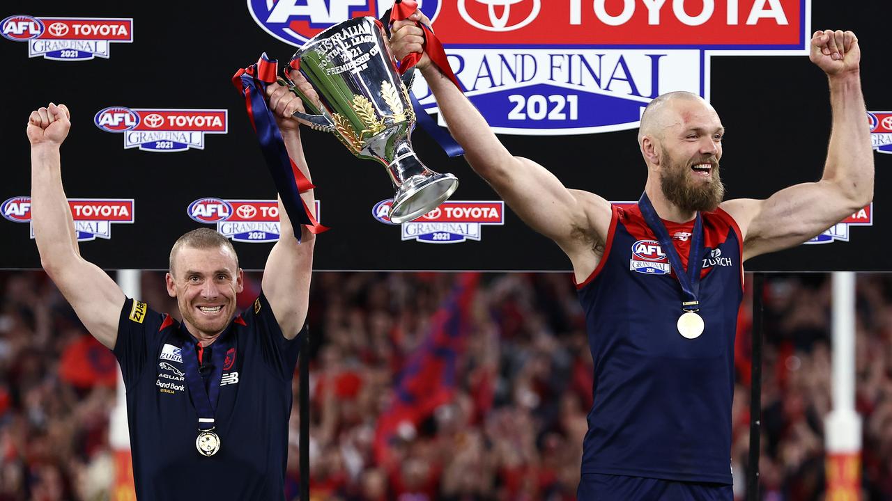 Simon Goodwin and Max Gawn lift the premiership cup. Picture: Michael Klein