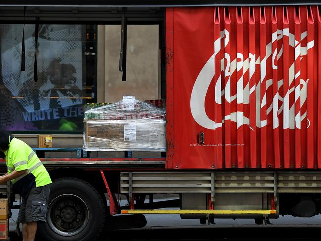 SYDNEY, AUSTRALIA - NCA NewsWire Photos SEPTEMBER, 03, 2020: A worker unloads Coca-Cola Amatil (CCA) products outside the Australian Stock Exchange (ASX) in Sydney. Picture: NCA NewsWire/Joel Carrett
