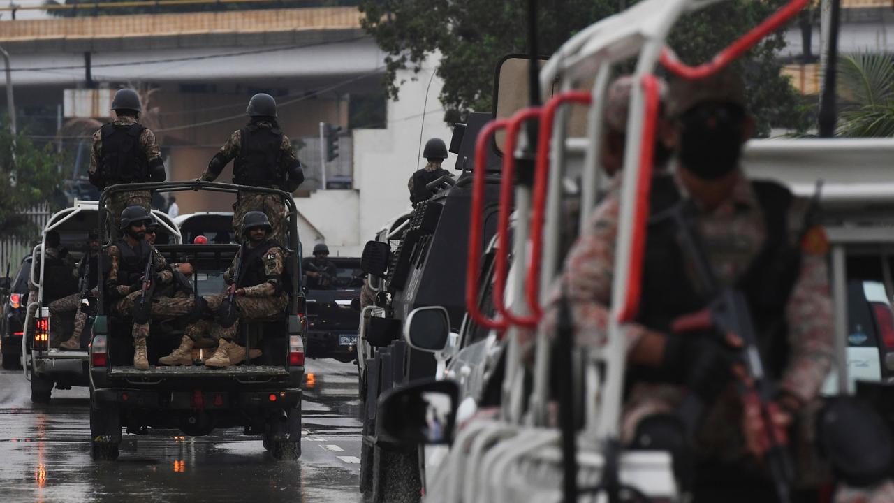 Soldiers escort the vehicles carrying Sri Lankan and Pakistani cricket teams as they leave the National Cricket Stadium in Karachi in 2019.