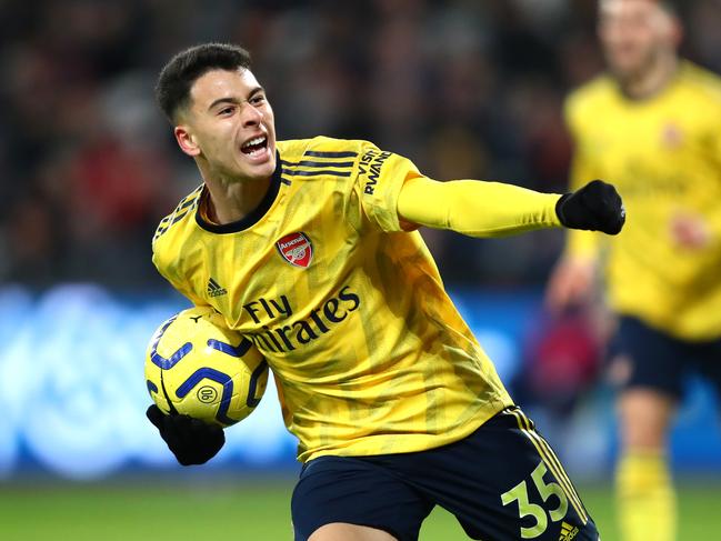 LONDON, ENGLAND - DECEMBER 09: Gabriel Martinelli of Arsenal celebrates after scoring his sides first goal  during the Premier League match between West Ham United and Arsenal FC at London Stadium on December 09, 2019 in London, United Kingdom. (Photo by Julian Finney/Getty Images)