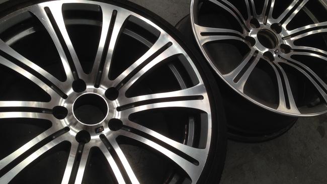 Spot the difference ... counterfeit BMW wheel (left) and the real deal (right). Picture: Joshua Dowling