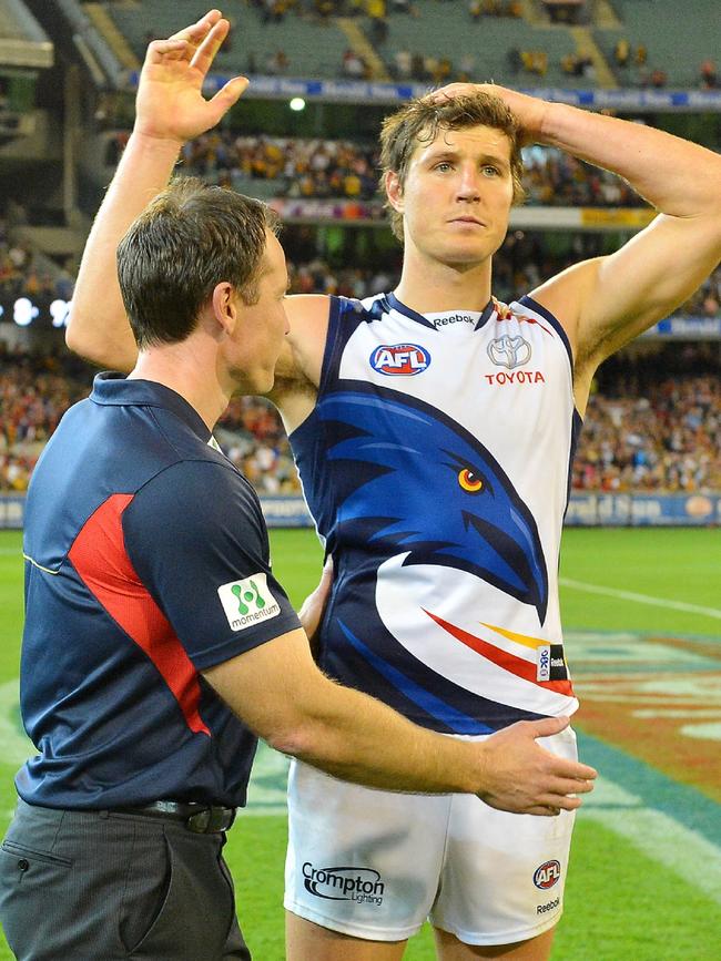 Brenton Sanderson with Kurt Tippett after the preliminary final loss. Picture: George Salpigtidis