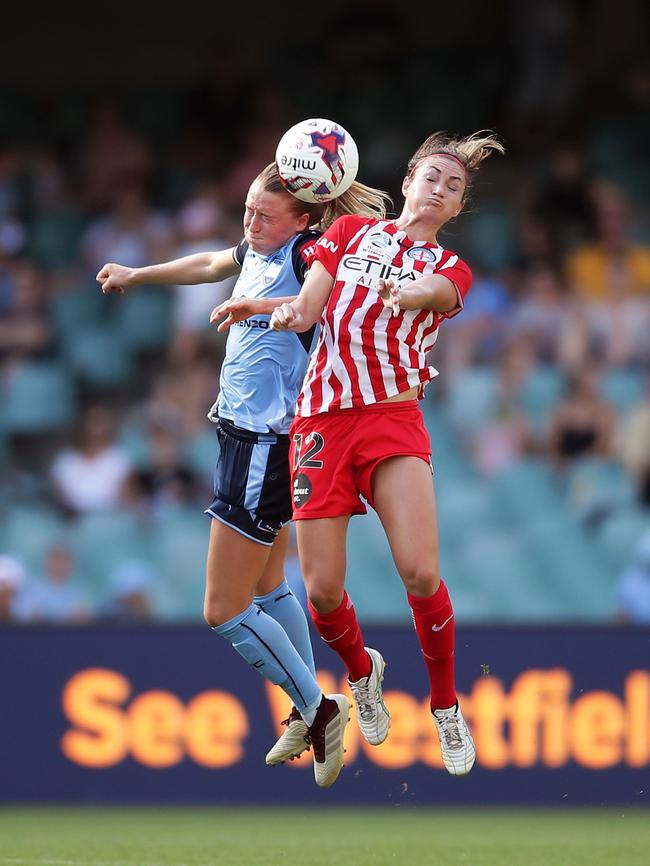 Emily Sonnett of Sydney and Jodie Taylor of Melbourne City rise into the air. Picture: Getty