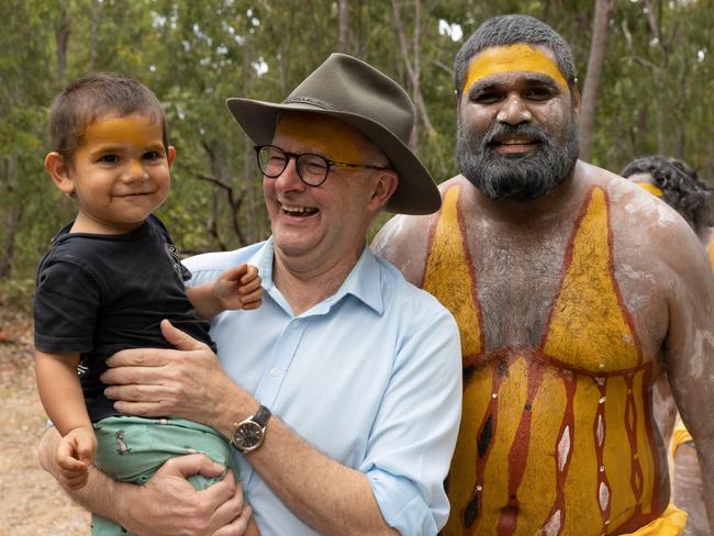 EAST ARNHEM, AUSTRALIA - JULY 29: Australian Prime Minister Anthony Albanese interacts with a child during the Garma Festival at Gulkula on July 29, 2022 in East Arnhem, Australia.  The annual Garma festival is held at Gulkula, a significant ceremonial site for the Yolngu people of northeast Arnhem Land about 40km from Nhulunbuy on the Gove peninsula in East Arnhem. The festival is a celebration of Yolngu culture aimed at sharing culture and knowledge which also brings politicians and Indigenous leaders together to discuss issues facing Australia's Aboriginal and Torres Strait Islander people. This year is the first time the festival has been held since 2019 following a two-year absence due to the COVID-19 pandemic. (Photo by Tamati Smith/Getty Images)