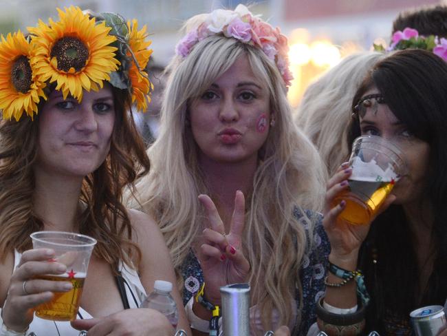 A Woodstock for the milennials ... festival-goers pose on the first day of Coachella. Picture: AFP PHOTO / ROBYN BECK