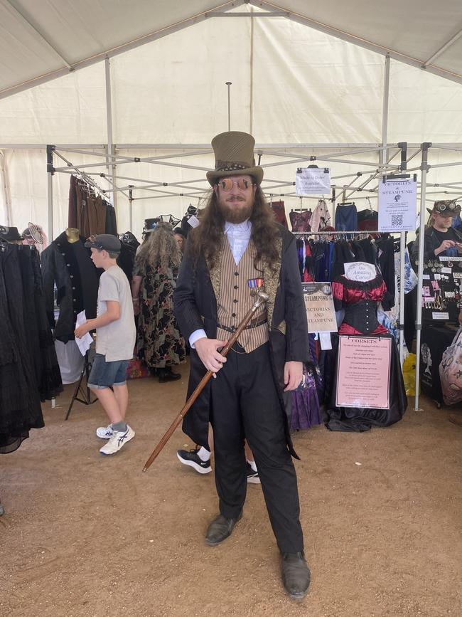 A fan of the Victorian era dressed up in a top hat, tailcoat and vest, holding a cane. Picture: Niki Iliagoueva