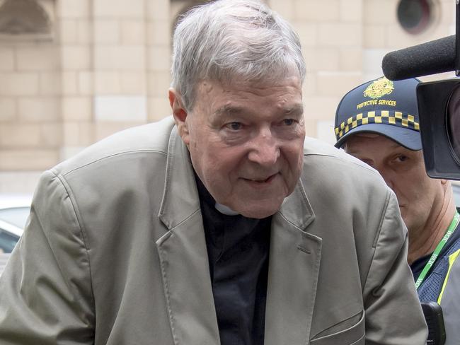 In this Feb. 26, 2019, photo, Cardinal George Pell leaves the County Court in Melbourne, Australia. An Australian inquiry says Pell knew that a pedophile priest had been sexually abusing children years before his arrest and had been aware of the Catholic Churchâ€™s clergy abuse problem since the early 1970s. A report from the inquiry on child sexual abuse had been released in 2017, but findings concerning Pell had been redacted to avoid prejudicing juries. (AP Photo/Andy Brownbill)