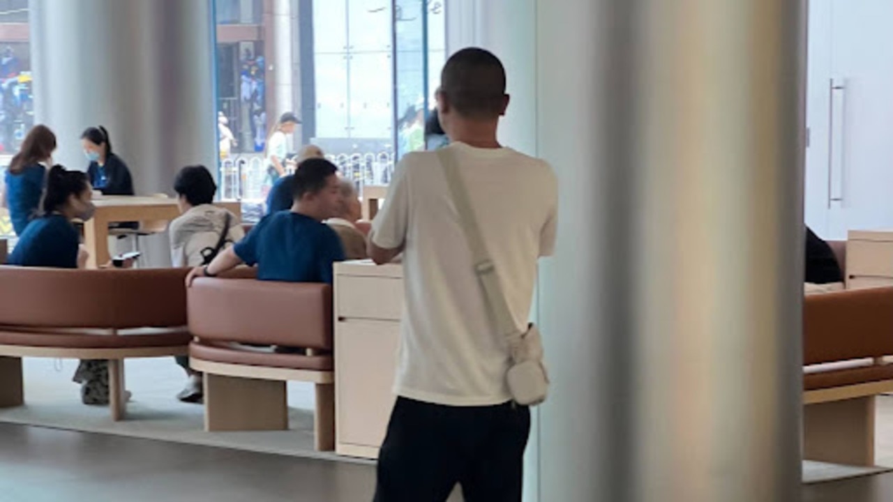 Pictured (in white T-shirt and eshay bag): My scammer was exceptional at flattery. Picture: Josh Jennings