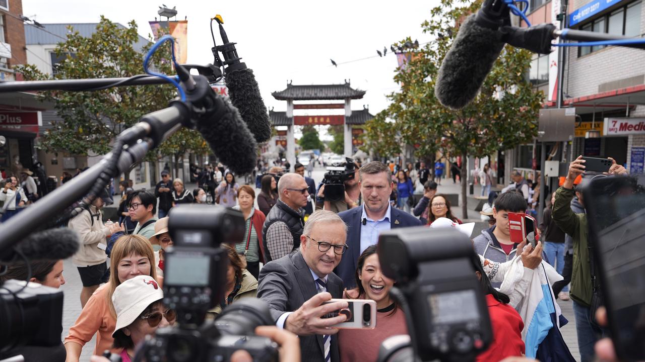 Australian Prime Minister Anthony Albanese takes photographs with members of the public during a visit to Freedom Plaza in the suburb of Cabramatta. (Photo by Asanka Ratnayake/Getty Images)
