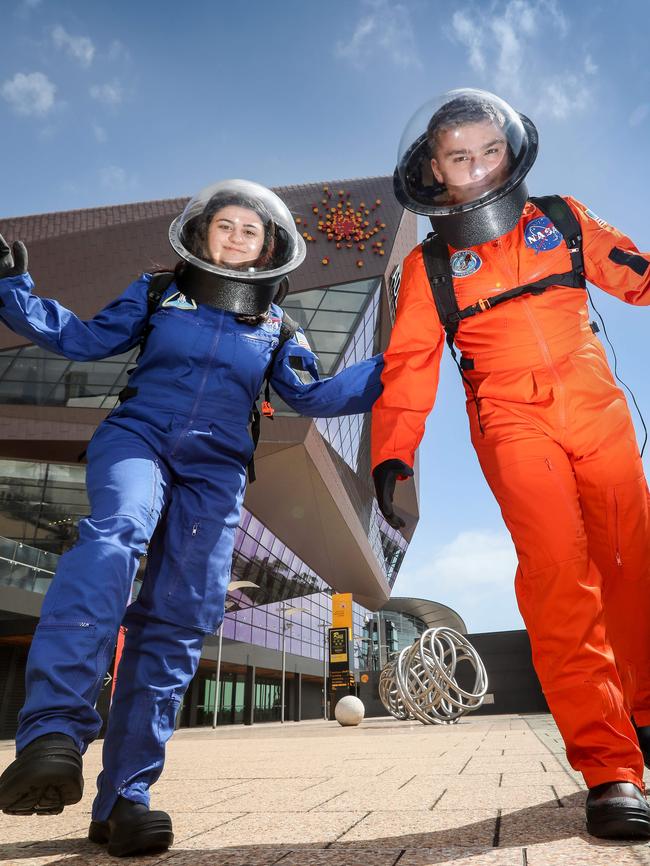 Students Katrina Cecere-Palazzo and Nicholas Volkmann-Scales from Hamilton Secondary College’ space school at the Adelaide Convention Centre, where the 68th International Astronautical Congress will take place. Picture: AAP/Russell Millard