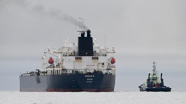 The Eagle S with a tugboat, pictured in the Gulf of Finland. Its sailors are suspected of sabotaging undersea cables in the Baltic Sea. Picture: AFP