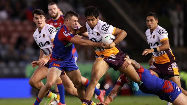 NEWCASTLE, AUSTRALIA – MAY 19: Selwyn Cobbo of the Broncos is tackled during the round 11 NRL match between the Newcastle Knights and the Brisbane Broncos at McDonald Jones Stadium, on May 19, 2022, in Newcastle, Australia. (Photo by Cameron Spencer/Getty Images)