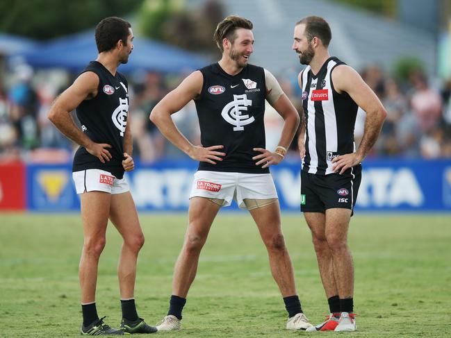 MELBOURNE, AUSTRALIA - MARCH 11: A defeated Dale Thomas of the Blues (C) reacts with Steele Sidebottom of the Magpies during the 2019 JLT Community Series match between the Collingwood Magpies and the Carlton Blues at Morewell Recreation Reserve on March 11, 2019 in Melbourne, Australia. (Photo by Michael Dodge/Getty Images)