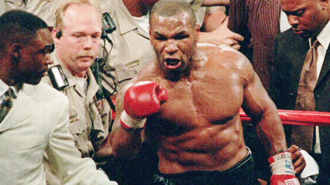 Mike Tyson unleashed hell in the ring but he wasn’t the same menacing figure when walking out to the ring. (AP Photo/Lennox/Mclendon)