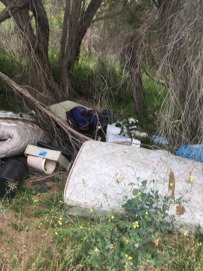 Filthy mattresses, smashed televisions and snapped camping chairs were among the litter. Photo: Andrew Burke