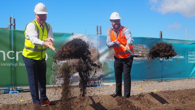 Sunshine Coast Mayor Mark Jamieson and McNab Sunshine Coast construction manager Carl Nancarrow turn the first sod for the new city hall at the Maroochydore City Centre.